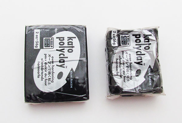 Two blocks of black Kato polymer clay