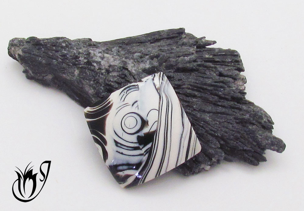 Black and white polymer clay Mokume Gane bead